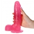 Dildo réaliste avec ventouse et texture translucide stimulante.